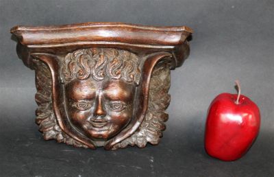 French carved oak wall shelf with cherub. Late 19th century. 5 3/4"h x 9 1/2"w x 4 1/2"d
