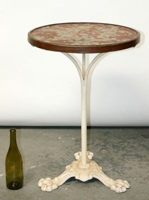 French bistro table with cast iron base and banded marble top. French round bistro table with 