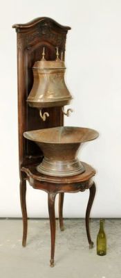 French Provincial copper lavabo mounted on walnut stand. Early 20th century. 73"h x 22 3/4"w x 