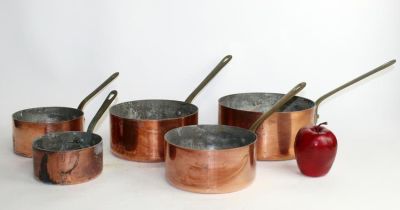 French copper nest of 5 pots 4"h, 8"diam x 15 1/2"w including handle. 3"h x 9"l overall