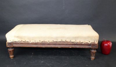 French Louis XVI footstool with fluted legs. French Louis XVI style footstool in walnut with 