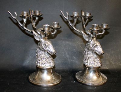 Pair silver plate stag head candelabra. Pair silverplate stag head candelabra. 11"h x 5"dia at base