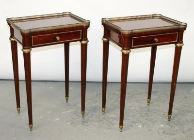 Pair of Louis XVI style mahogany side tables with brass gallery. Early 20th century. 27"h x 18 