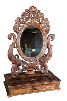 French Black Forest relief carved vanity mirror. Late 19th century. 24"h x 15 1/4"w x 8 1/2"d 