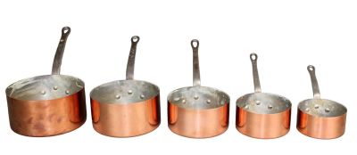 Nest of 5 French copper pots with iron handles. Mid 20th century. Sizes range from 4 1/2"h-7 