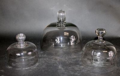 Set of 3 French blown glass cloches. Early 20th century. 5 3/4"h x 5 5/8"dia, 6 7/8"h x 6 