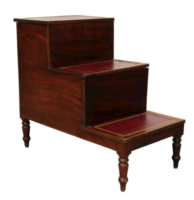 English mahogany library steps with embossed leather panels and interior step storage. Early 