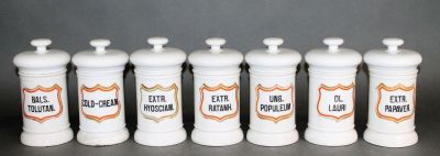 Lot of 7 French porcelain apothecary jars. Lot of 7 French porcelain lidded apothecary jars. Mid 