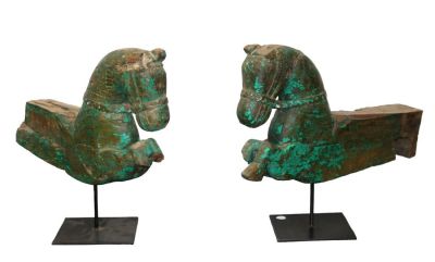 Pair antique wooden horse fragment carvings. Later mounted on iron stands. 21"h x 23" and 20 