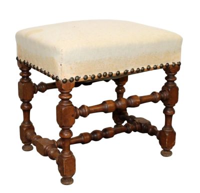 French Louis XIII style walnut foot stool. Early 20th century. Covered in muslin. 18 1/4"h x 