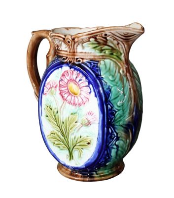 French Majolica pitcher with daisy. Early 20th century. 9"h x 8 1/4"w x 4 3/4"d