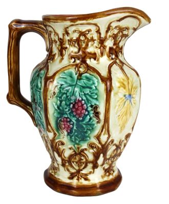 French Majolica pitcher with grape motif and naturalistic handle. Impressed underglaze mark B5. 