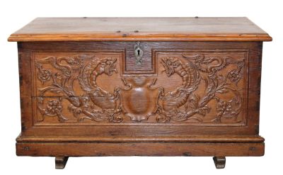 French carved oak trunk with griffins flanking shield. Iron handles. Late 19th century. 21 