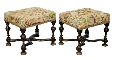 Pair of French stools with needlepoint upholstery. Pair of French stools on carved walnut legs 