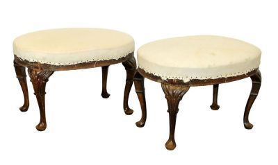 Pair of French oval foot stools in walnut with pad feet. Not upholstered. Early 20th century. 