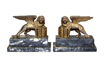 Pair of gilt metal San Marco lion bookends on marble bases. Mid 20th century. 5 1/4"h x 6 1/4"w 