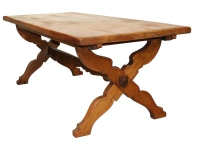 French waxed oak trestle table with shaped crossed supports with carved crest. Mid 20th 