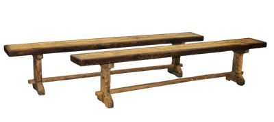 Pair of French trestle base backless benches in oak. Mid 20th century. 17 3/4"h x 84"l x 10"d