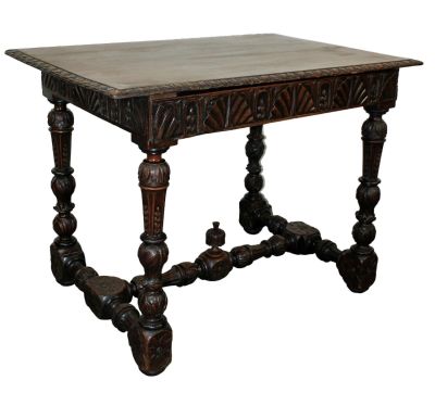 English carved walnut tavern table with drawer. On turned carved legs with 4 sides apron carved 