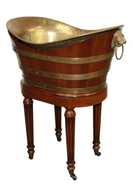 Brass cellarette with lion heads in mahogany and brass banded stand. cellarette 27 1/4"h x 13 