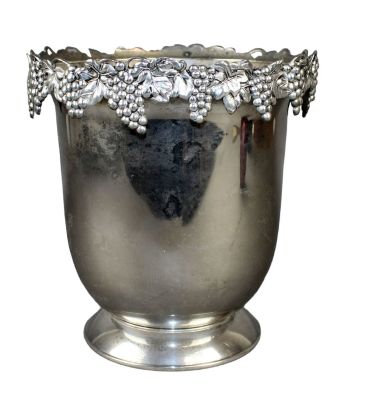 Silver plated champagne bucket with grapevine in relief. Silver plated champagne bucket with 