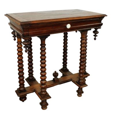 French side table in walnut on 6 bobbin leg base with center finial. Single drawer. Late 19th 