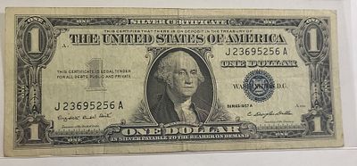 1957A silver cert dollar bill currency blue seal. check out the pics you decide the grade