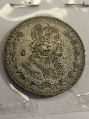 1966 Mexican silver dollar peso coin. check out thepics