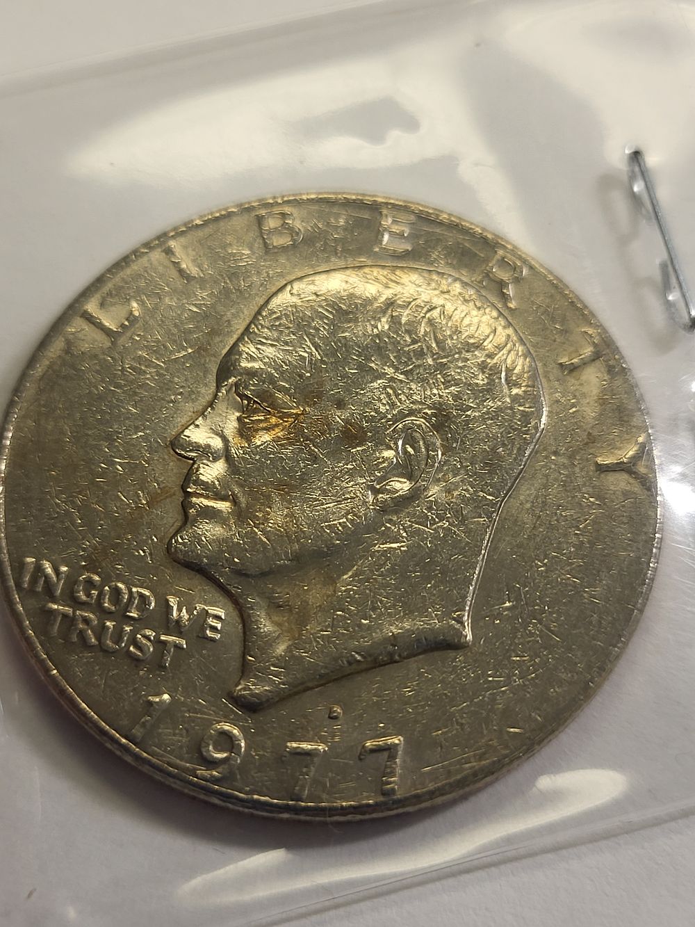 1977 ike dollar error? filled D us coin. check out the pics you decide