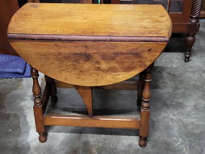 antique abraham & strauss drop leaf maple table. from estate 23" tall 26" deep 29" with both 