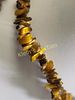 natural tiger eye necklace 34" nice. all natural tiger eye and great color yes it is cold to the Image - 1