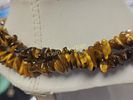 natural tiger eye necklace 34" nice. all natural tiger eye and great color yes it is cold to the Image - 2