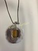 tiger eye pendant w/18" chain german silver. very pretty with original tag see pics tiger eye Image - 1