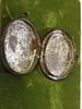 Antique oval Tin locket Victorian hand painted. 2 1/2" by 2" when opens has pictures of girls Image - 1