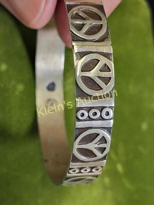 taxco elj signed sterling peace sign bracelet. from estate 2 1/2" wide inside 10 mm wide band 