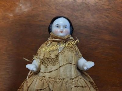 antique german china head doll 4" tall. molded and painted hair and painted face he is all 