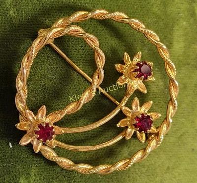 gorgeous mid century starburst brooch w/ruby color stonesnice twisted rose detail 1 1/2" wide 
