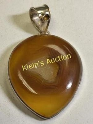 sterling silver & brown nude agate pendant. 42.4mm x 49.9 mm center of agate crystal picks up 