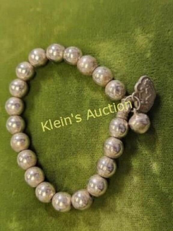 silver Beaded Oriental Bracelet. not magnetic see pics also has a charm