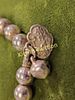 silver Beaded Oriental Bracelet. not magnetic see pics also has a charmImage - 1