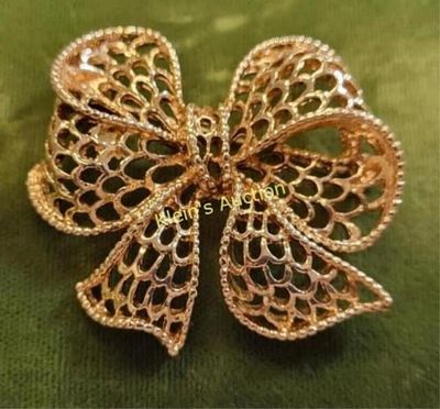 Napier vintage gold tone bow brooch. 2" wide and very pretty signed on back seepics