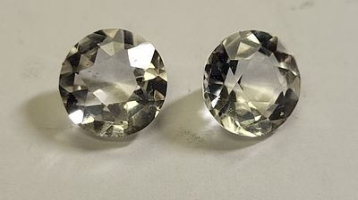4 carats of moissanite 2 carats each round brilliant. brilliant! from estate 7.7mm and 7.9 mm 4 