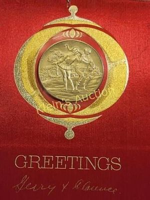 1969 franklin mint christmas coin medallion. in its original sealed card not sure if gold 