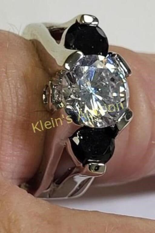 Lot 5465 – tri stone engagement ring white & black sapphire