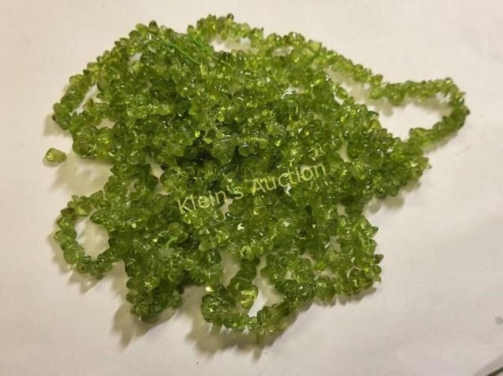Lot 5487 – 315 carats of peridot gemstones from necklace