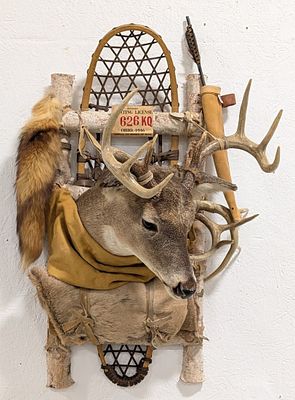 Hunters Pack Whitetail Deer Snow Show Taxidermy Display. Features a makeshift back pack made of 