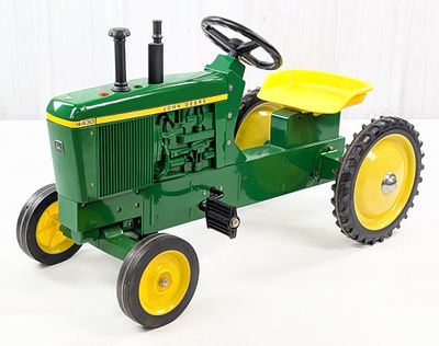 Ertl John Deere 4430 Pedal Tractor. Ertl John Deere 4430 pedal tractor. The tractor is in good 