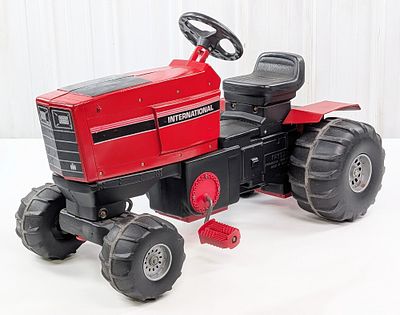 Ertl International Pedal Tractor. Ertl International pedal tractor. The tractor is made of 