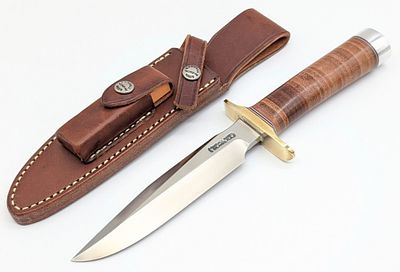 Randall Model 1 6in All Purpose Fighter w/ Sheath. Features a brass double downturned guard, a 