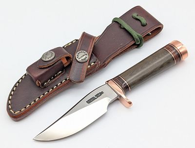 Randall Model 27 Brown Micarta Mini Trailblazer w/ Sheath. Features a brass single downturned 